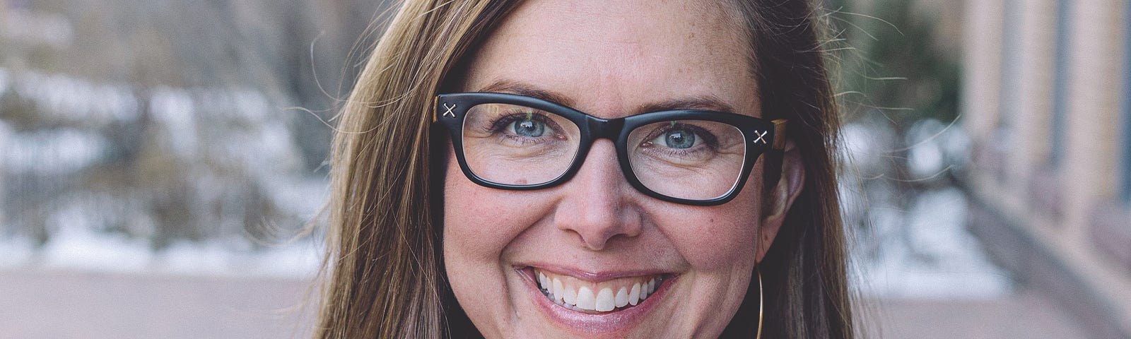 Headshot of Haley Lowry smiling in an outdoor environment.