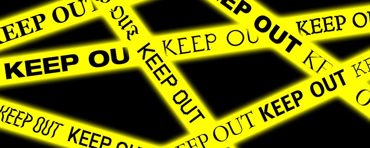 Criss-crossed strips of yellow police tape with the words “keep out” repeated in different font families.