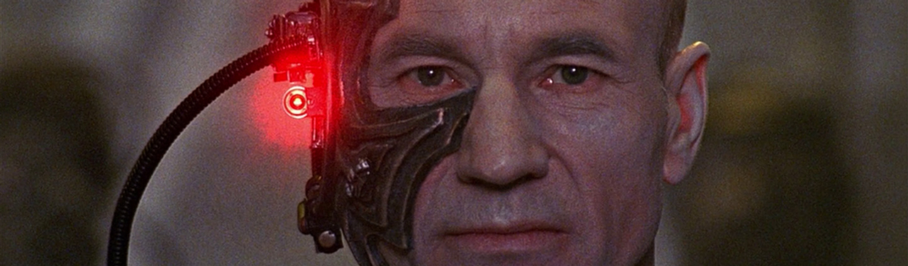 Most of the left side of Captain Picard’s face is covered with a Borg maskthat shines a red laser into the camera.