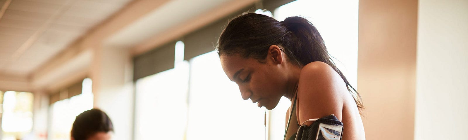 Girl on treadmill in a gym.