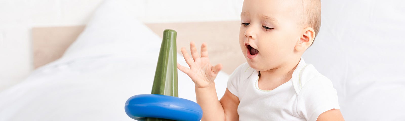 A baby playing with toys.