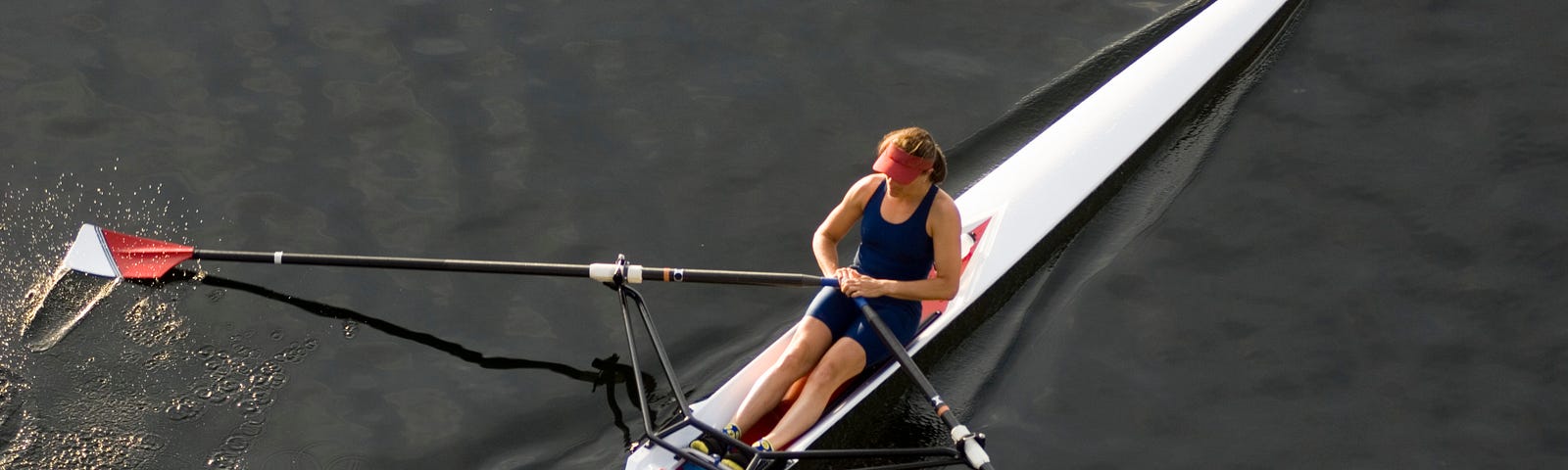 A woman rowing a kayak.