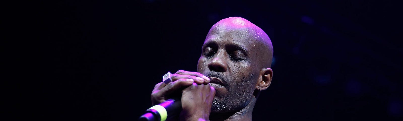 DMX prays during a performance at Barclays Center in Brooklyn, New York on April 21, 2017.