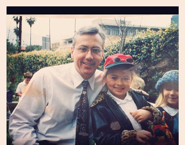 A photo of the writer as a child with her father.