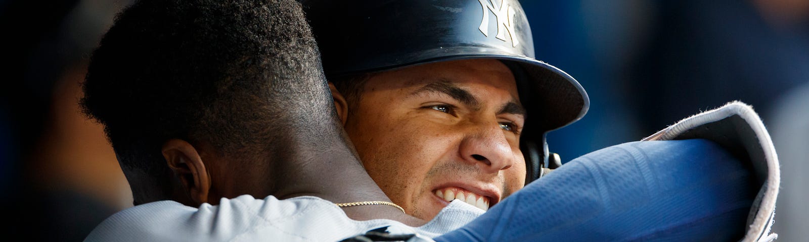 NY Yankees teammates Gleyber Torres and Cameron Maybin hug as they celebrate a two run home run against the Toronto Blue Jays