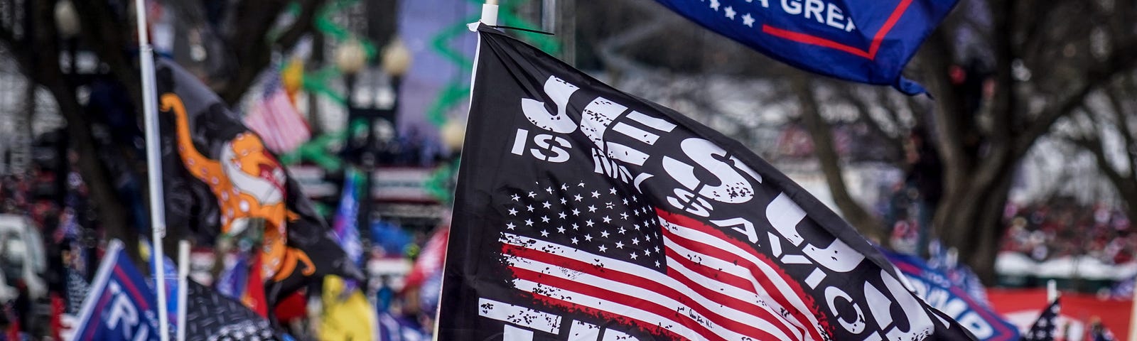 Trump supporters flying flags near the U.S. Capitol following the Stop the Steal rally on January 6, 2021 in Washington, DC.