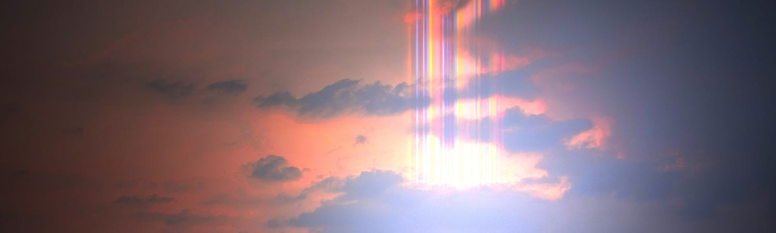 Beautiful rainbow flare in the sunset sky with bright light.