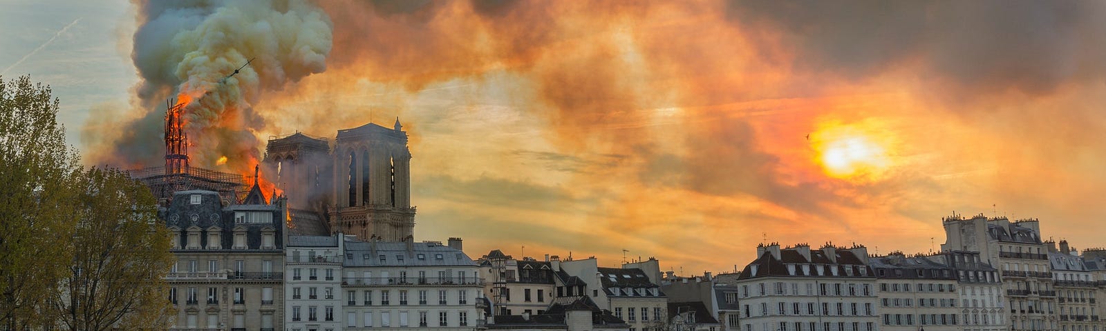 Notre Dame Cathedral Burning, Smoke and fire in an orange sky April 2019