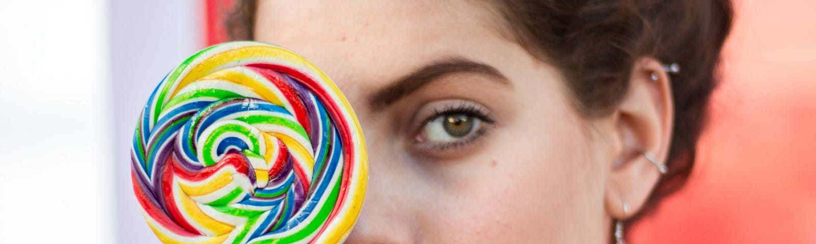 Picture of woman holding lollipop