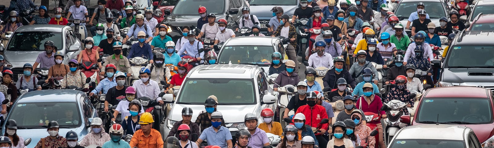 Motorbike riders with face masks are stuck in traffic during the morning peak hour on May 19, 2020 in Hanoi, Vietnam.