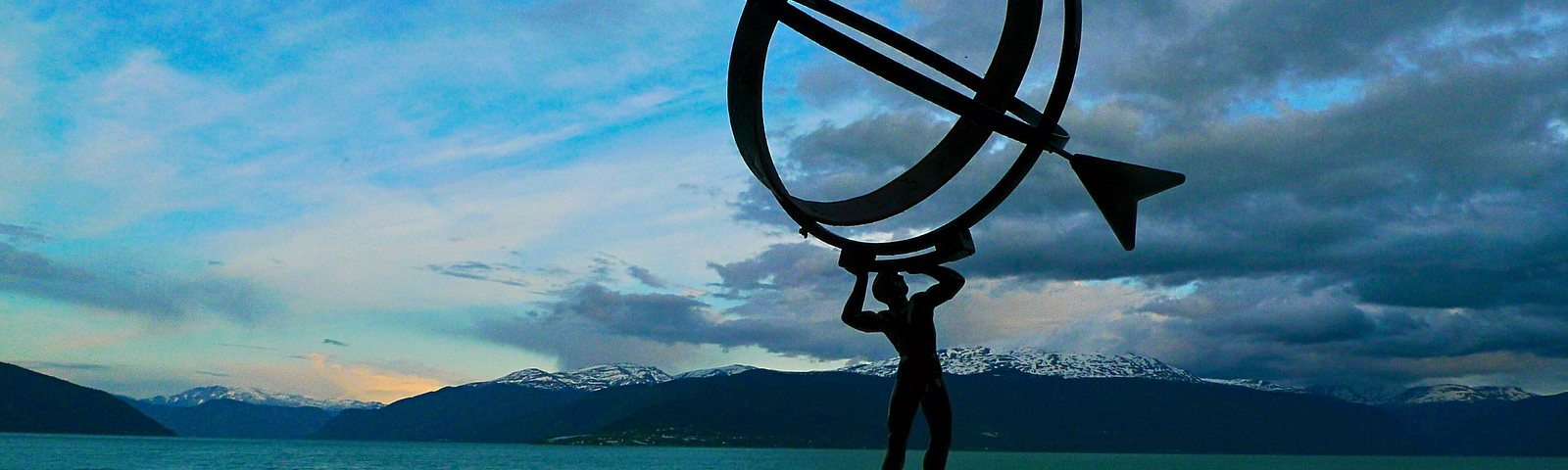 Finnish sculpture of a man holding a sundial.
