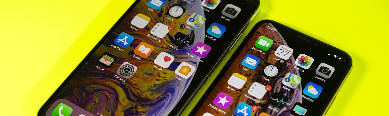 The new Apple iPhone Xs and Xs Max against a bright modern neon yellow background.