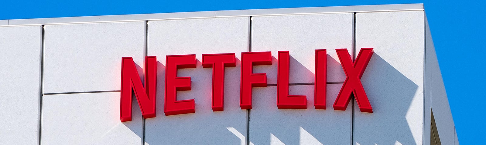 A view of the Netflix logo on the exterior of its corporate office at Sunset Bronson Studios in Los Angeles.