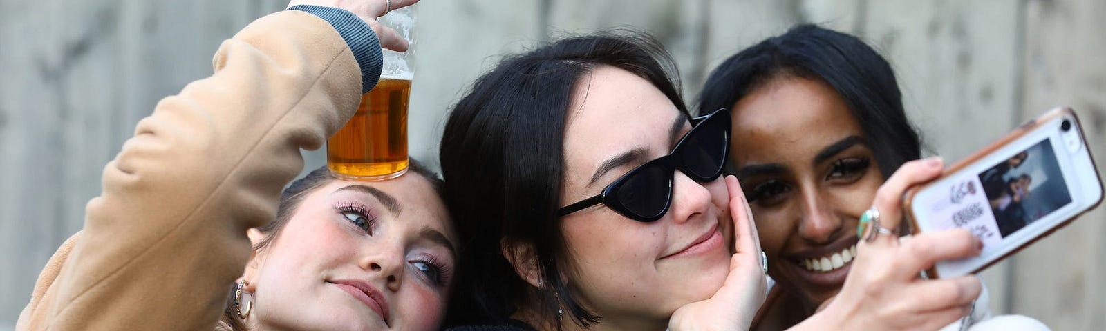 A group of women taking a selfie.