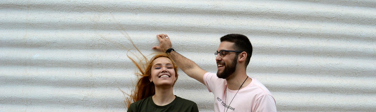 A man and a woman laughing together