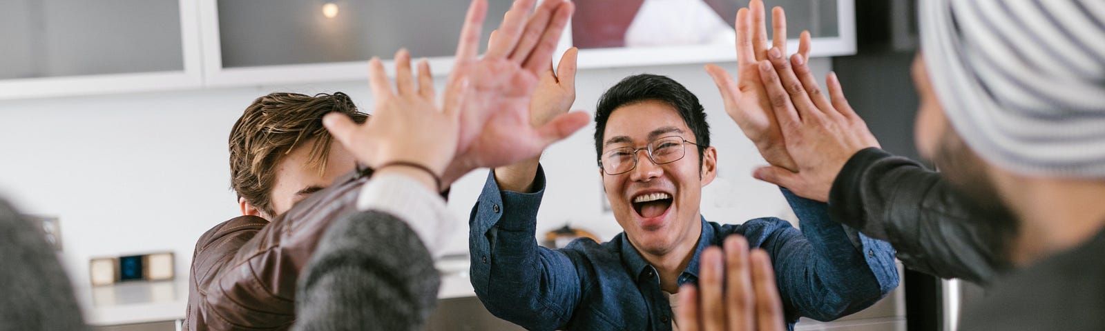 A team celebrates their success in the office