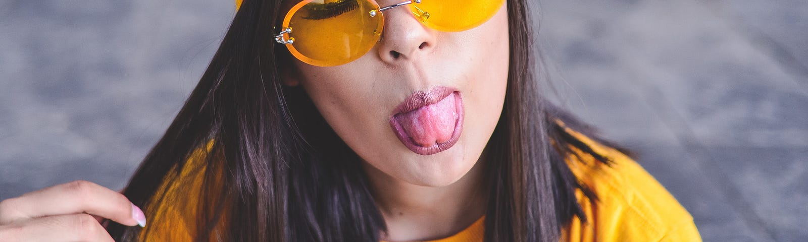 woman playfully sticking out her tongue