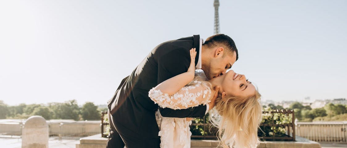 A groom “dips” his bride while kissing her neck. #love #romantic #wedding #romance #inlovewithlove