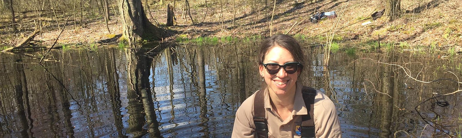 Melissa Althouse, FWS Scholar and Service Biologist, holds the egg mass of an Spotted salamander (Ambystoma maculatum) while monitoring vernal pools for spring breeding amphibians.