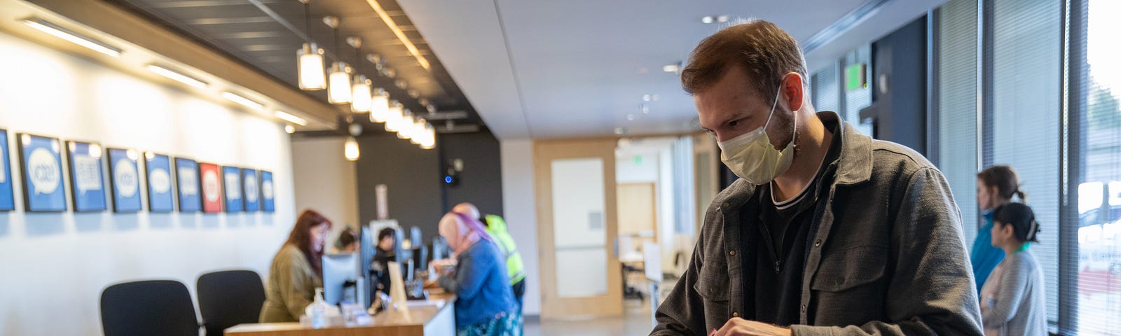 A voter casts his ballot during early voting at the King County Elections processing center on March 9, 2020 in Renton, WA.