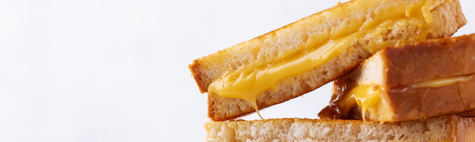 A close-up of a grilled cheese sandwich.