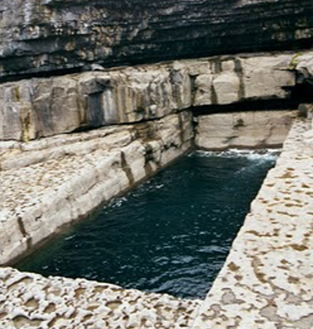 A geologic anomaly on Ireland’s Aran Islands—a perfectly rectangular hole eroded out of the limestone shoreline, below the island’s cliffside.