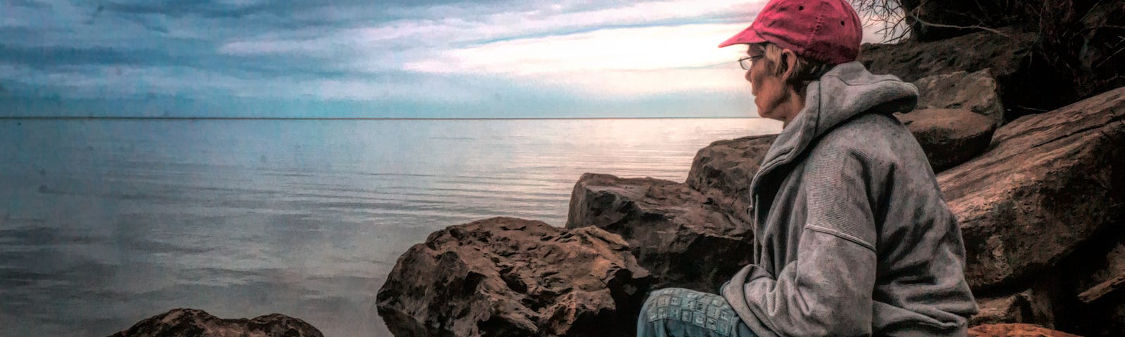 I am sitting on the shoreline of Lake Ontario, watching the waters rise