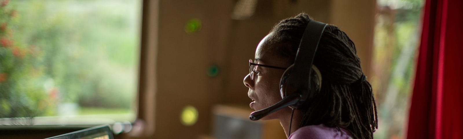 Black woman talking to her team over a video call.