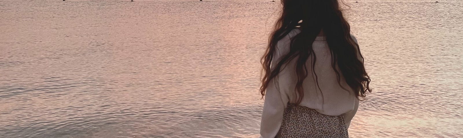 Woman gazing at the ocean