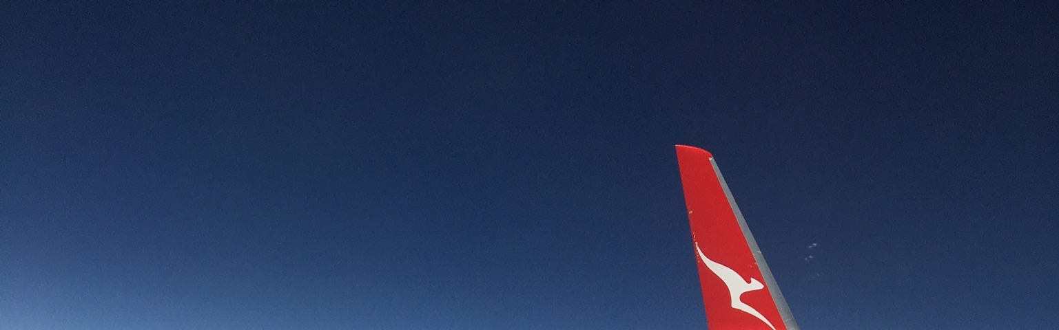 View from an airplanes window, ground below