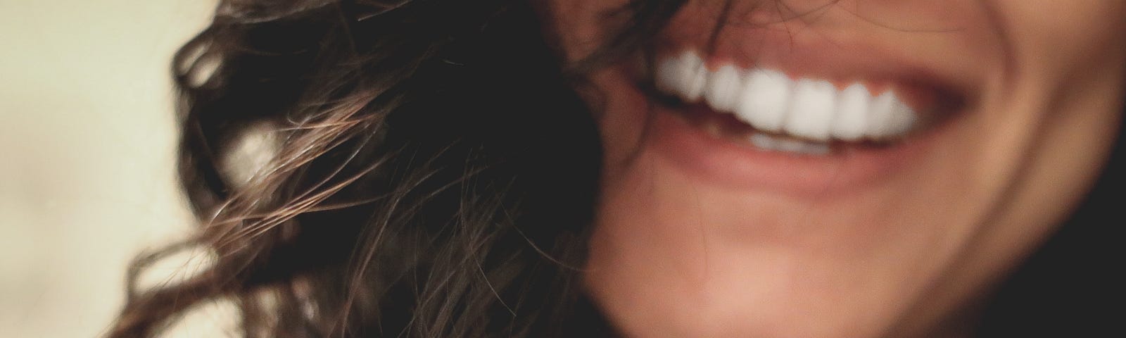 Closeup of woman smiling.