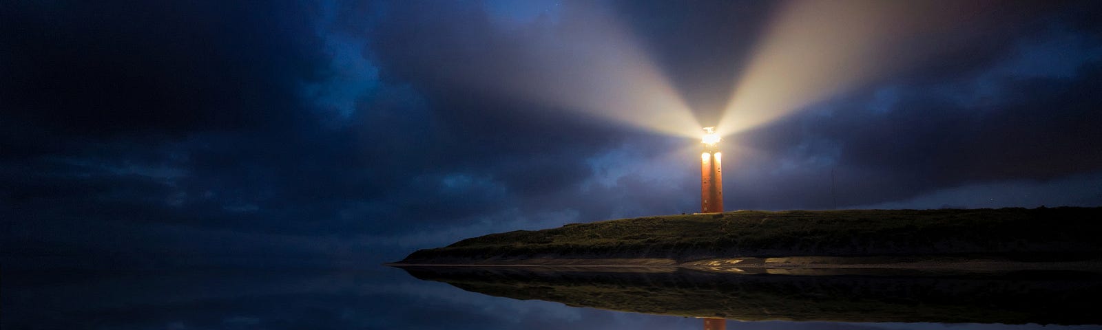 A graphic picture of a Lighthouse flashing at night.