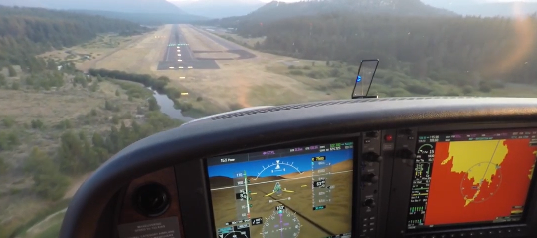 Photo of glass cockpit with terrain awareness and an angle of attack indicator.