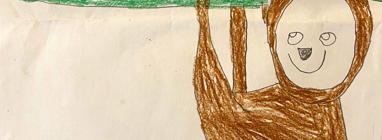 A child’s drawing of a smiling sloth hanging upside down from a tree.