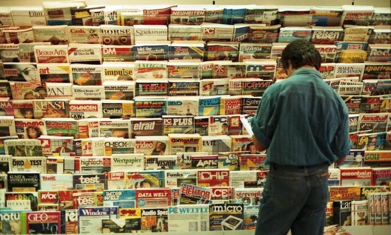 A man looking at magazines