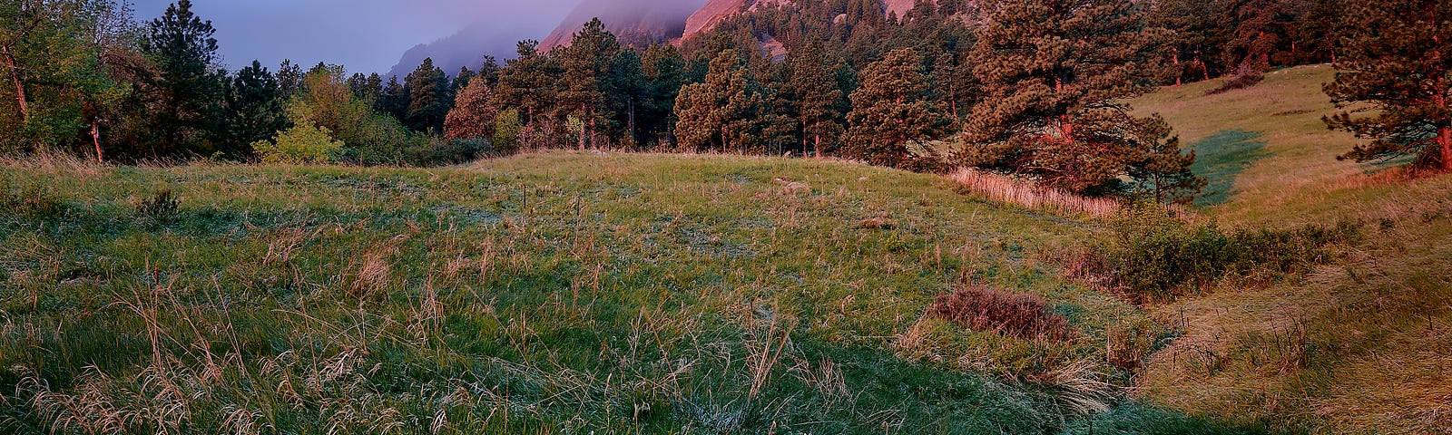 The Flatirons of Boulder, Colorado shimmer in morning light.