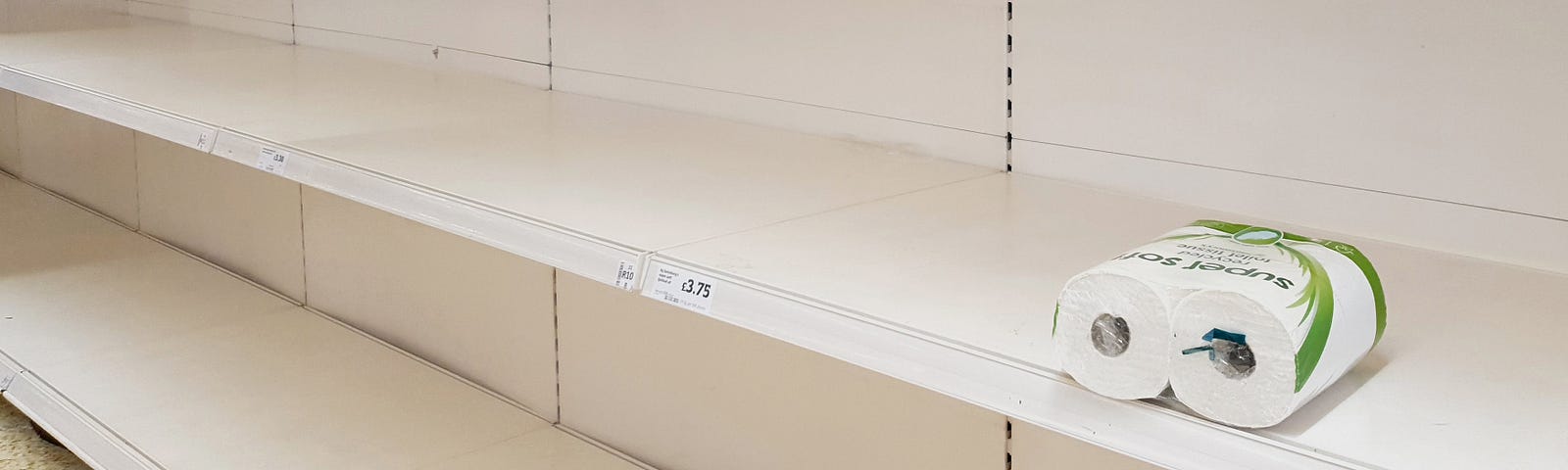 A view of empty shelves as toilet roll is almost sold out in a supermarket.