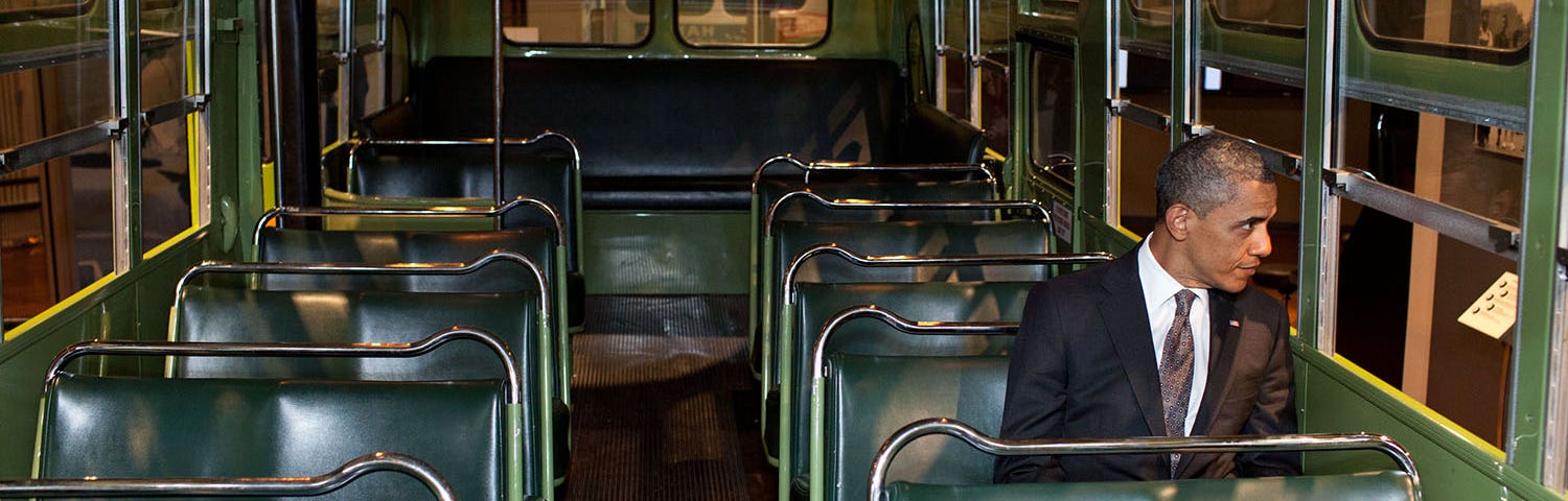 President Barack Obama sits on the bus where Rosa Parks changed history, sparking the civil rights movement. She was told to move to the back of the bus to make room for a white passenger, and she refused to move. Obama has also refused to move, remaining the most important Democratic leader 20 years after he burst onto the national stage and more than seven years since leaving the White House. The bus is displayed at the Henry Ford Museum in Dearborn, Michigan. White House photo.