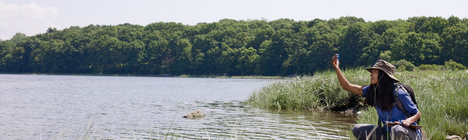 Environmentalist taking water sample