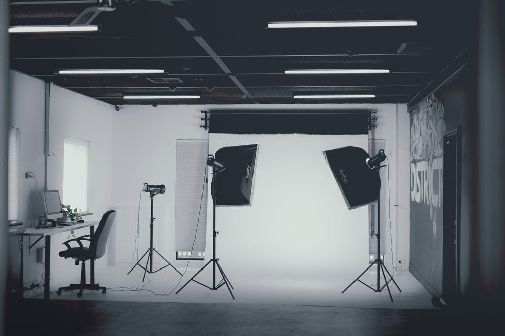 Empty photo studio, with lighting and a computer