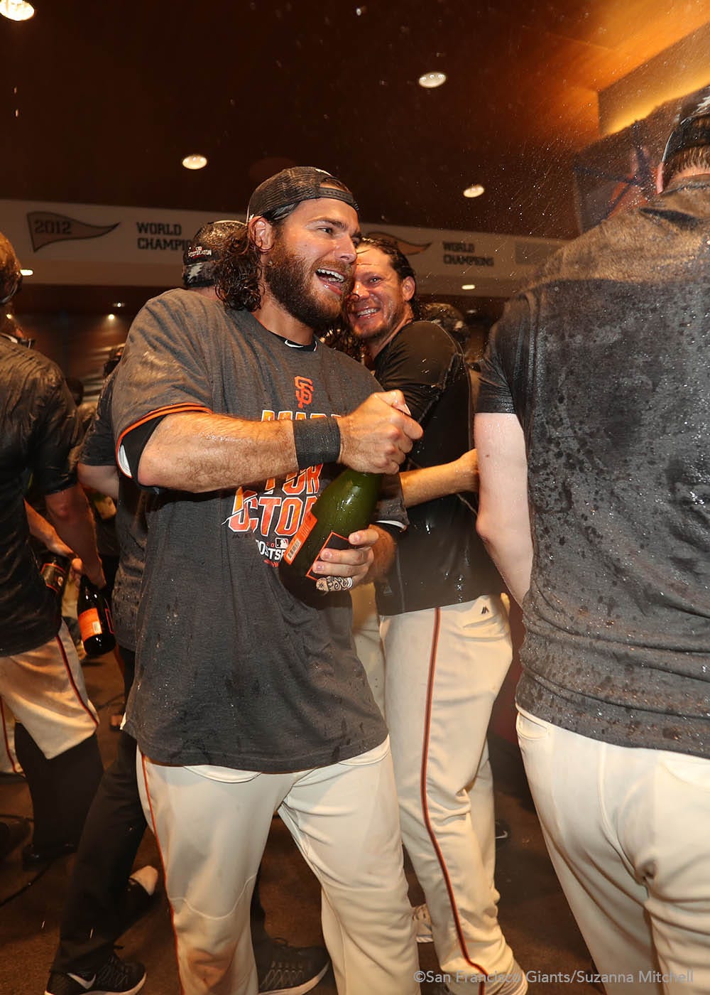 Brandon Crawford celebrates in the clubhouse.