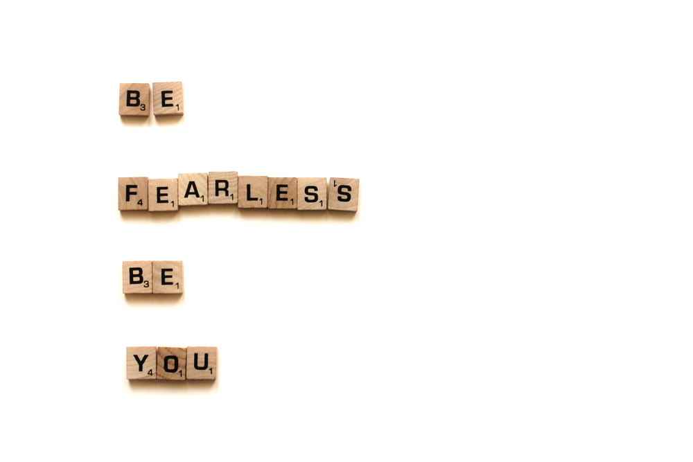 Scrabble blocks spelling out: “Be fearless, Be you”