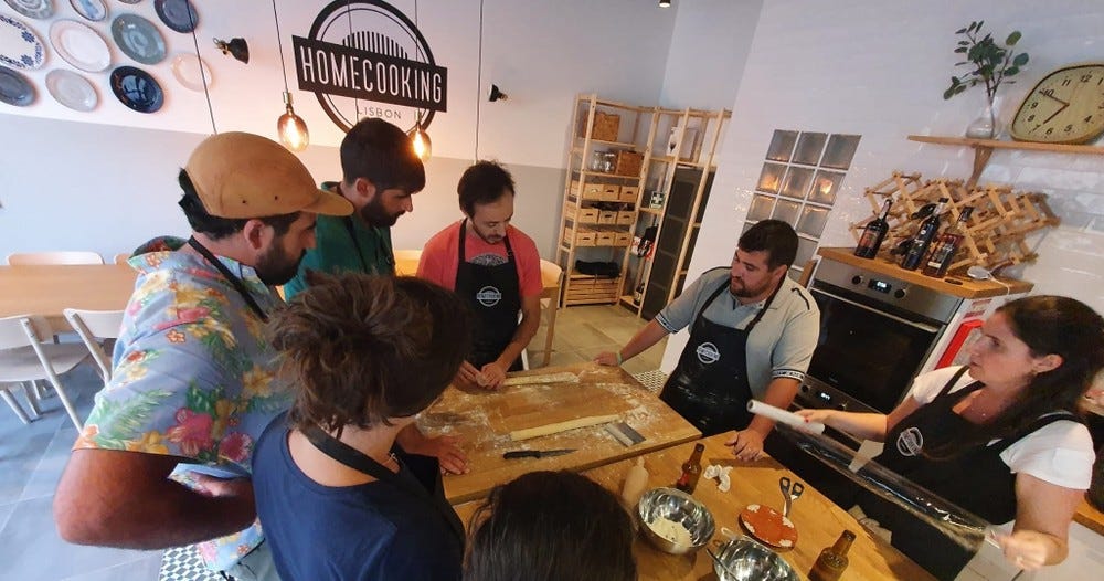 Group of people at a Pastéis de Nata workshop.