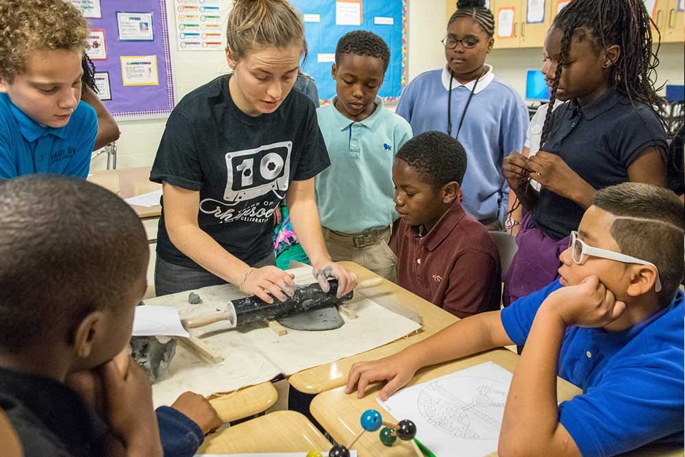 Dunbar sixth graders work with PAA Artist-Educator Ainsley Buckner during a recent residency workshop.