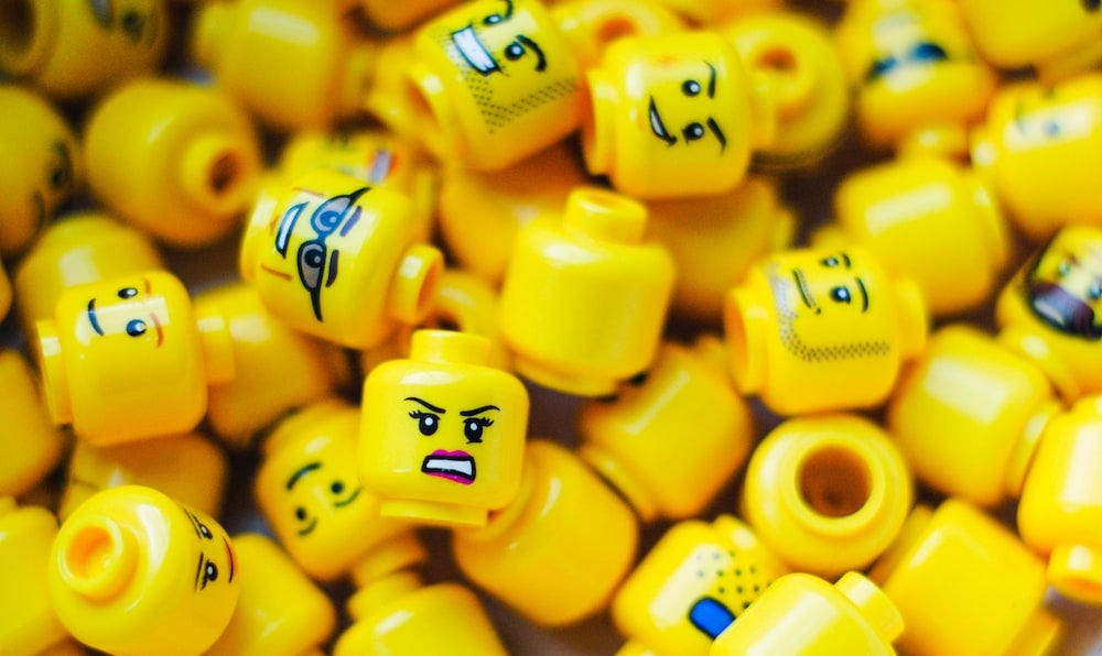 Pile of Lego minifigure heads.