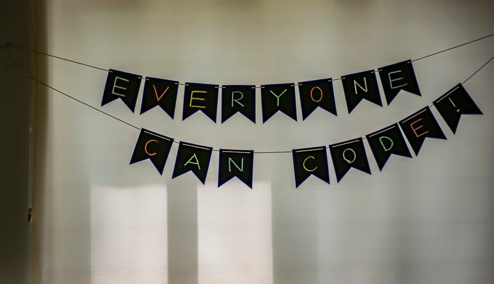 A banner saying “everyone can code”