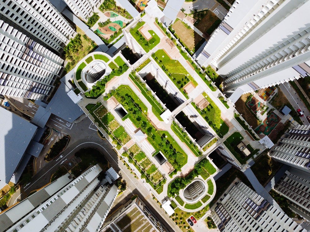 An aerial view of a green rooftop on a skyscraper
