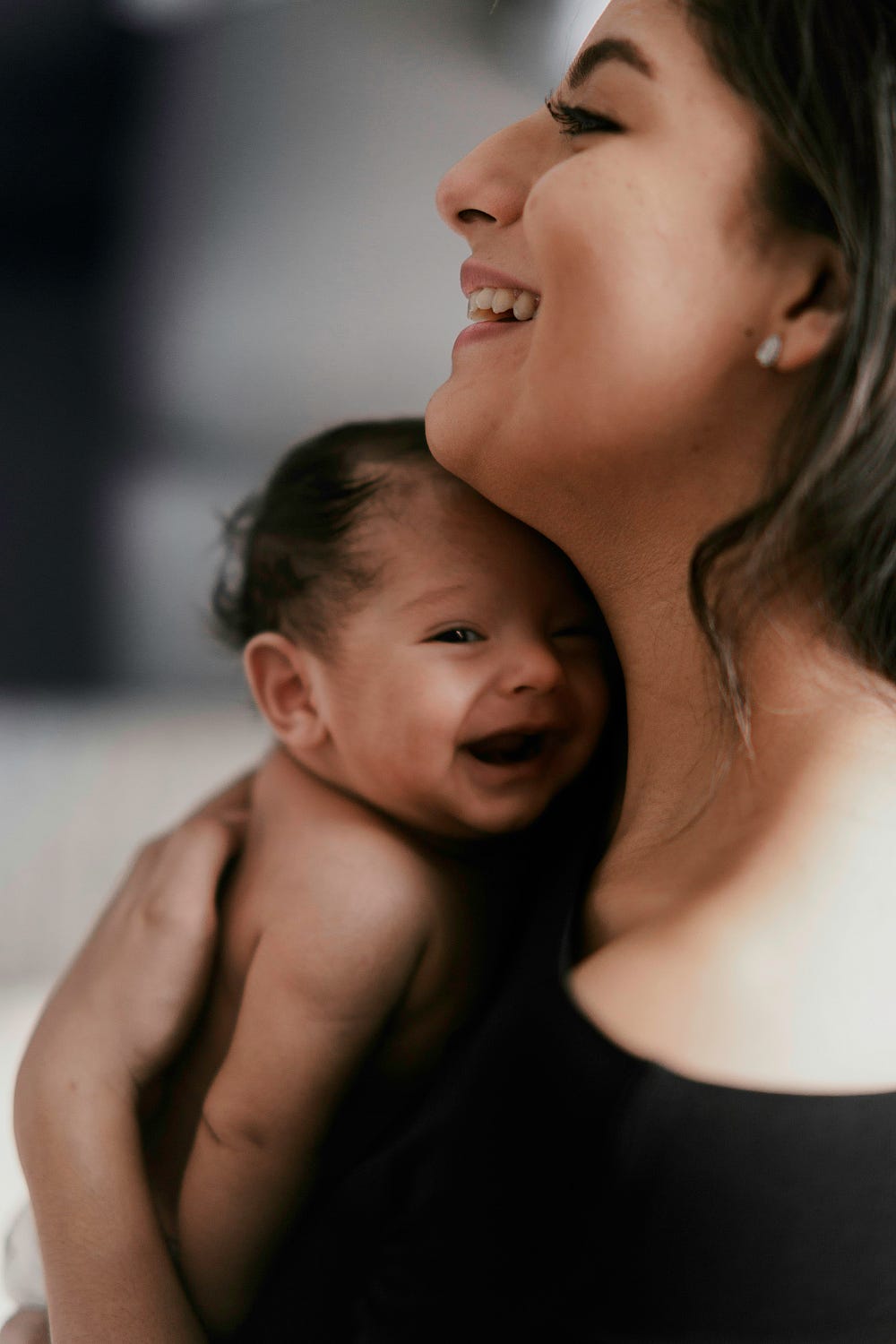 Mother and baby laughing 