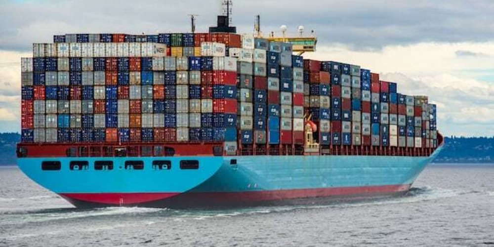 Many containers packed together on a ship