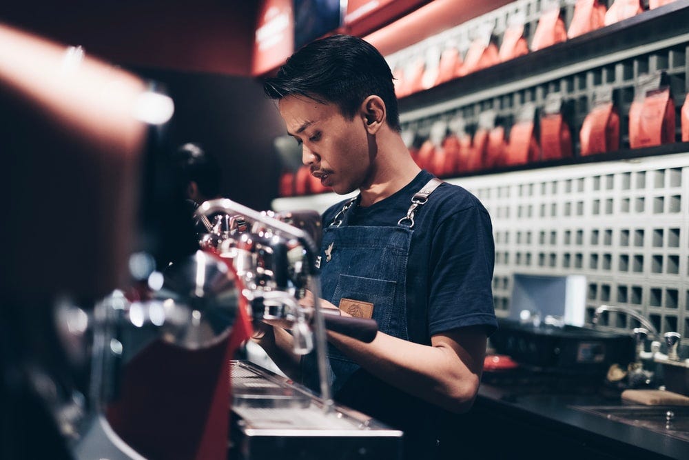 Barista working at a chic coffee shop